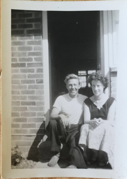Charles Higgs with wife sitting on doorstep