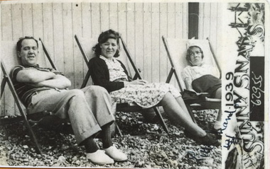 Pop wife and young Renee in deckchairs