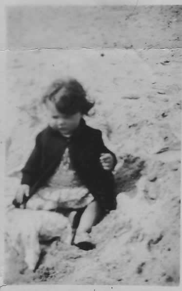 Renee on the beach about 2yrs old